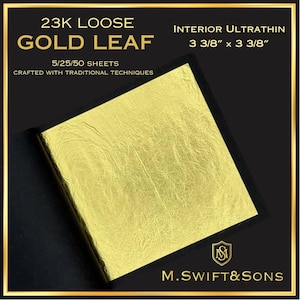 May include: A square of 23K loose gold leaf, measuring 3 3/8" x 3 3/8", is displayed on a black background. The text "GOLD LEAF" is prominently featured, along with "5/25/50 SHEETS" and "CRAFTED WITH TRADITIONAL TECHNIQUES". The brand logo "M. SWIFT & SONS" is also visible.
