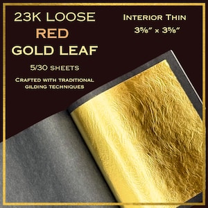 May include: 23K loose red gold leaf sheets, interior thin, 3 5/8" x 3 5/8". The image shows a stack of gold leaf sheets with the text "Crafted with traditional gilding techniques". The gold leaf has a textured appearance and is displayed on a dark background.