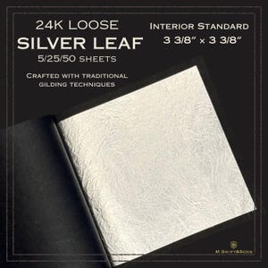 May include: Open book with silver leaf sheets. The text reads "24K Loose Silver Leaf" and "Crafted with Traditional Gilding Techniques." The sheets measure 3 3/8" x 3 3/8". The book is black with a gold border and the logo "M. Swift & Sons."