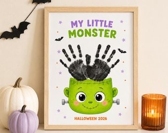 Puede incluir: Una impresión enmarcada con el texto MY LITTLE MONSTER en morado y verde, con dos huellas de manos negras sobre una cabeza de monstruo verde con pernos. El texto HALLOWEEN 2026 aparece en la parte inferior, rodeado de estrellas moradas, puntos naranjas y murciélagos.