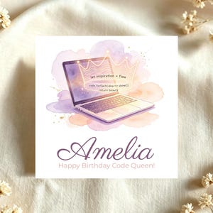 May include: A square greeting card featuring a watercolour illustration of a laptop with a glowing crown graphic above it. The screen displays code text including let inspiration = flow. Below the laptop, the name Amelia is printed in purple script.