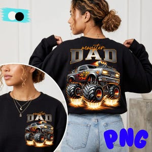 Pode incluir: Camisola preta com um gr&aacute;fico de monster truck e o texto "monster DAD". O design apresenta um cami&atilde;o prateado com chamas laranja e amarelas, pneus grandes e o texto "monster DAD" em negrito.