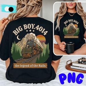 May include: Black t-shirt featuring a graphic of a vintage steam train, mountains, and a sunset. The text reads "BIG BOY.4014" above the train and "the legend of the Rails" below. A classic design for train enthusiasts.