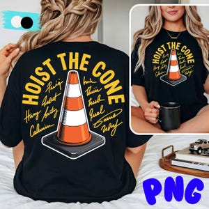 May include: Black t-shirt featuring a graphic of an orange and white traffic cone with the text "HOIST THE CONE" in yellow. The design includes signatures around the cone. A smaller version of the design is on the front.