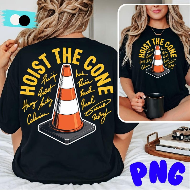 May include: Black t-shirt featuring a graphic of an orange and white traffic cone with the text "HOIST THE CONE" in yellow. The design includes signatures around the cone. A smaller version of the design is on the front.