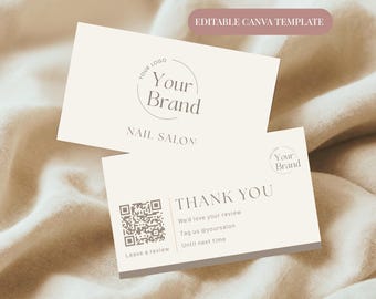 May include: Two cream-colored business cards with text. One card reads "Your Brand" and "NAIL SALON". The other card says "THANK YOU" with a QR code and "We'd love your review". The words "EDITABLE CANVA TEMPLATE" are at the top.