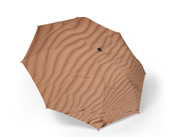 Paraply med sanddynmönster