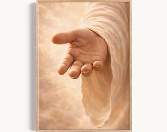 May include: A framed wall art print featuring a close-up of an outstretched hand reaching forward, draped in light-colored, flowing fabric. The background consists of soft, warm, golden-toned clouds, creating a bright and ethereal atmosphere.