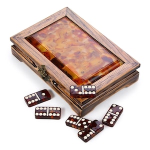 May include: A set of three ceramic mugs with a speckled, matte finish. The mugs are in shades of cream, light gray, and dark gray. Each mug has a simple, minimalist design, perfect for coffee or tea.