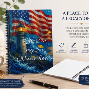 May include: A spiral-bound journal with a cover featuring a lighthouse, a waving American flag, and the text 'Letters to my son (Name here)'. The journal is displayed next to an open notebook, a pen, and a white mug with a heart design.