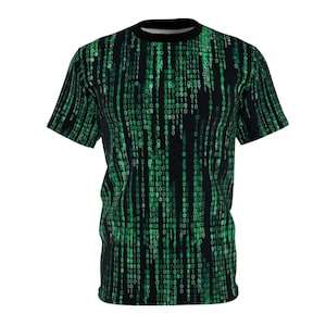 May include: Black t-shirt featuring a green binary code pattern. The design covers the entire shirt, creating a digital rain effect. The shirt has a crew neck and short sleeves, perfect for casual wear.