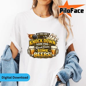 May include: White t-shirt featuring a bowling-themed graphic. The design includes a bowling ball, pins, and beer mugs, with the text "IF YOU CAN'T KNOCK DOWN SOME PINS, KNOCK DOWN SOME BEERS!". The shirt is a digital download.