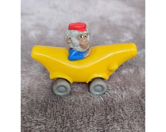 Vintage Monkey in Banana Car Toy Figure Yellow Cereal Prize Collectible