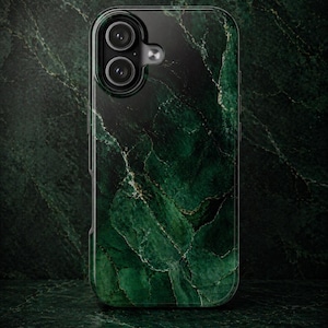 May include: A smartphone case with a dark green marble design. The case has a glossy finish and features a dual-lens camera cutout. The marble pattern includes veins of lighter green and gold.