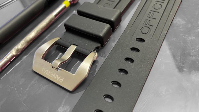 May include: A rustic wooden sign with the text "Welcome to our home" in white lettering. The sign features a distressed finish and a simple, inviting design, perfect for entryway decor.