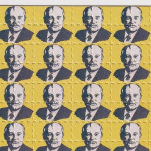 May include: A sheet of perforated squares featuring a repeating pattern of a man in a suit and tie. The portraits are in black and white against a yellow background.