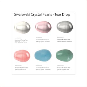 May include: A display of Swarovski Crystal Pearls in a tear drop shape. The image shows six different colors: white, pink, light grey, pink coral, turquoise, and jade. Each pearl has the Swarovski brand name and product information.
