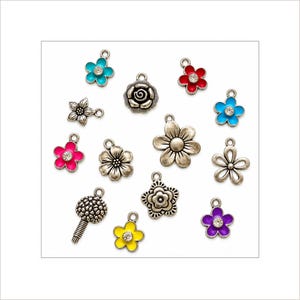 May include: A collection of twelve metal flower charms in various designs. Some charms feature colorful enamel in shades of blue, red, pink, yellow, and purple with a central clear rhinestone, while others are plain silver-toned metal floral shapes.