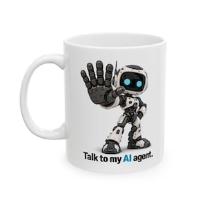May include: A white ceramic mug featuring a graphic of a small, white and black robot with glowing blue eyes, holding its hand up in a stop gesture. Below the robot, the text reads, "Talk to my AI agent." in black and blue lettering.