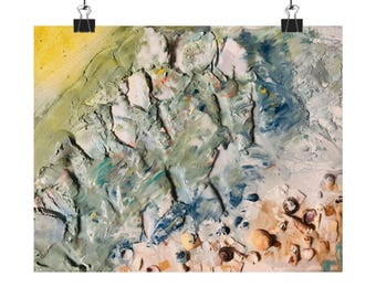 May include: A textured wall art piece featuring a thick impasto application of paint in shades of yellow, blue, white, and green. The composition includes embedded small seashells and sand-like particles, creating a three-dimensional effect.