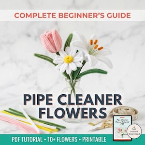 May include: A bouquet of handmade pipe cleaner flowers in a clear glass vase. The flowers include a pink tulip, white daisy, and white lily. The image also shows pipe cleaners, scissors, a measuring tape, and a tablet with the text "Pipe Cleaner Flower Tutorial PDF". The text "COMPLETE BEGINNER'S GUIDE" and "PIPE CLEANER FLOWERS" are also visible.