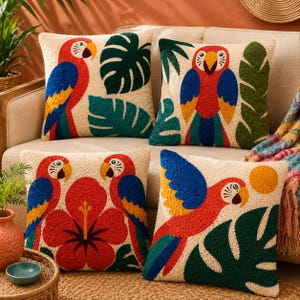May include: Four square throw pillows with a textured, tufted surface. Each pillow features a cream-colored background with vibrant, multi-colored parrot illustrations, green tropical leaves, red hibiscus flowers, and a yellow sun design.