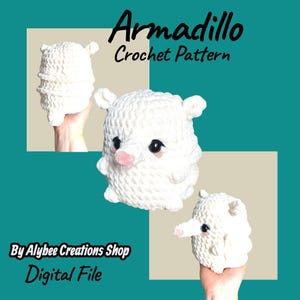 May include: White crochet armadillo pattern with black eyes and a pink nose. The image includes the text "Armadillo Crochet Pattern" and "By Alybee Creations Shop Digital File". The armadillo has small ears and is displayed in multiple views.