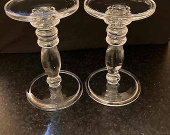 Elegant pair of tall vintage clear‑glass candle holders