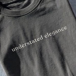 May include: A white ceramic mug with a black handle and the text "But First, Coffee" in a bold, black font. The mug is likely 11-15 ounces in size, perfect for a morning beverage.