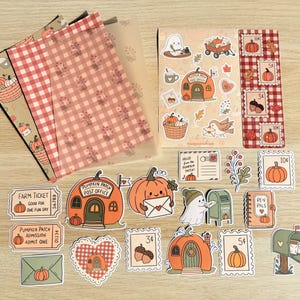 May include: A collection of autumn-themed stationery including patterned paper sheets, a sticker sheet, and individual die-cut stickers featuring pumpkins, a ghost, mailboxes, and postage stamps with text like Farm Ticket and Pumpkin Patch Post Office.