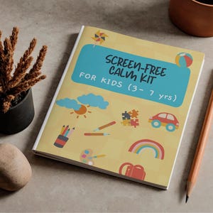 May include: A book titled "SCREEN-FREE CALM KIT" for children aged 3-7 years. The cover is yellow with illustrations of a sun, rainbow, car, and other playful images. A pencil rests on the side.
