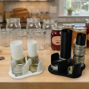 May include: A set of three ceramic mugs with a speckled, matte finish. The mugs are in shades of cream, light gray, and dark gray. Each mug has a simple, minimalist design and a rounded handle.