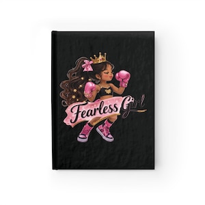 May include: Black notebook featuring a cartoon illustration of a girl wearing a gold crown and pink boxing gloves. The text "Fearless Girl" is displayed on a pink banner across the image.