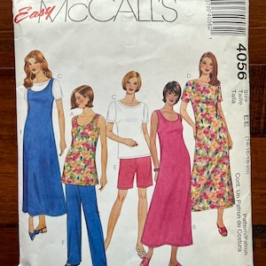 May include: A vintage McCall's sewing pattern envelope featuring illustrations of various women's dresses, tops, and pants. The pattern includes a range of sizes and styles, with the brand name "McCall's" prominently displayed at the top. The envelope is white with colorful illustrations.