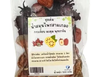 May include: A clear plastic bag filled with dried herbs and fruits, including dark red hibiscus flowers and brown dates. The bag has a label with Thai text and the words "Thai Herbs Store".