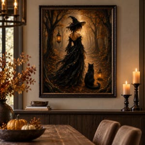 May include: A framed wall art print depicting a figure in a black dress and pointed hat standing in a dark, autumn forest with a black cat. A glowing lantern hangs from a tree branch, and another lantern sits on the ground near the cat.