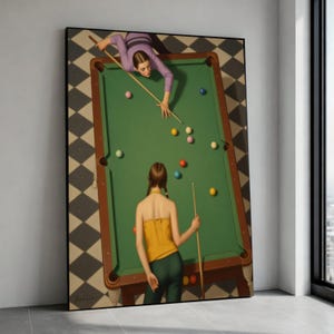 May include: A framed print of a billiards scene. Two people are positioned around a green pool table, one leaning over to take a shot. The table is surrounded by colorful billiard balls. The floor has a black and white checkered pattern.