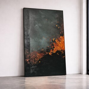 May include: Abstract art print with a dark, textured background. The artwork features a blend of deep blues, grays, and fiery orange hues, creating a dramatic and dynamic composition. The piece is framed in a sleek black frame.