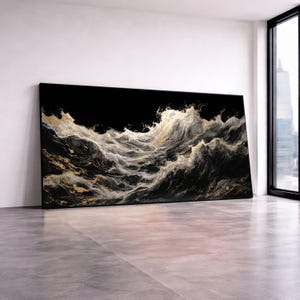May include: Large rectangular canvas art depicting a dramatic ocean scene. The artwork features a black background with swirling waves in shades of gold, white, and gray. The piece is displayed in a modern, minimalist room with a large window.
