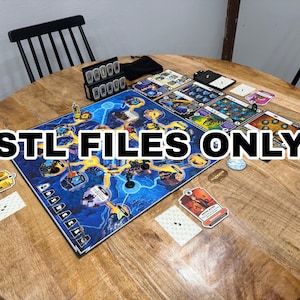 May include: A board game set on a round wooden table. The game board is blue with a yellow path design. Cards, tokens, and dice are scattered around the board. The text "STL FILES ONLY" is displayed across the image.