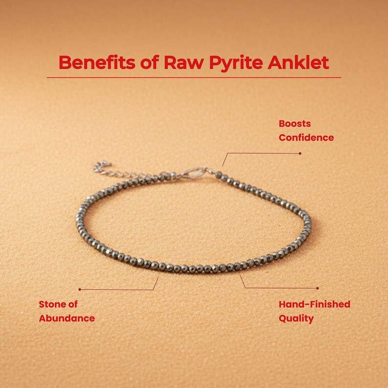 May include: A pyrite ankle bracelet with a silver clasp. The image includes text that reads "Benefits of Raw Pyrite Anklet", "Stone of Abundance", "Boosts Confidence", and "Hand-Finished Quality". The bracelet is made of small, round, dark grey beads.