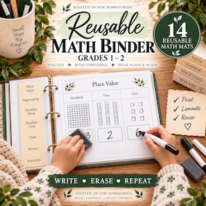 May include: A reusable math binder for grades 1-2 featuring 14 math mats. The binder includes tabs for place value, regrouping, number sense, number line, time, money, and fractions. The page shows a place value chart with hundreds, tens, and ones.