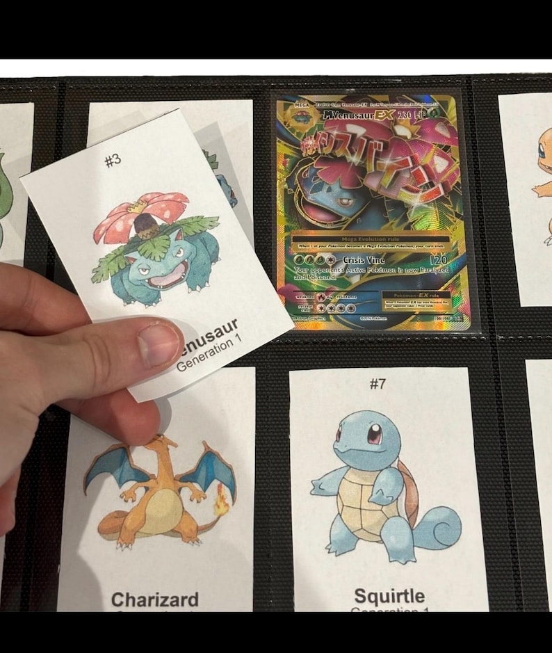 May include: A collection of Pok&eacute;mon trading cards in a binder. One card is being held up, featuring a drawing of Venusaur with the text "#3" and "Venusaur Generation 1". Other cards show Charizard and Squirtle.