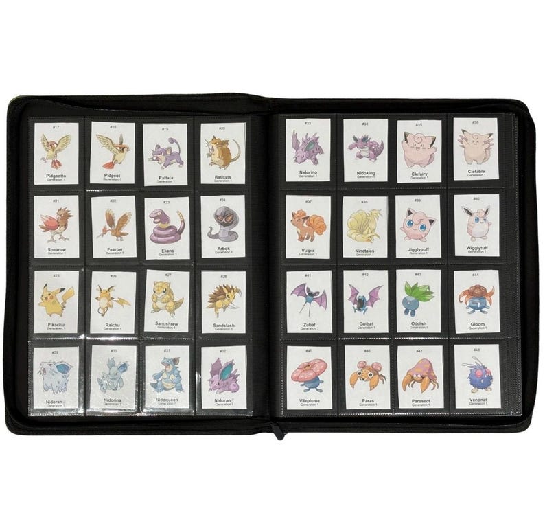 May include: A black, zippered binder filled with trading cards. The cards are in clear plastic sleeves and feature various colorful cartoon characters. The binder is open, displaying multiple rows of cards.