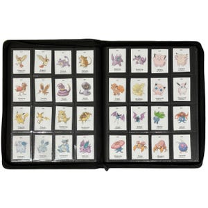 May include: A black binder filled with Pok&eacute;mon trading cards. The cards are in clear plastic sleeves and feature various colorful Pok&eacute;mon characters. The binder is open, displaying multiple rows of cards with different illustrations and names.