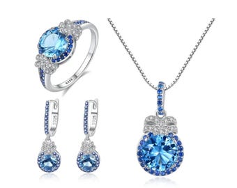 Conjunto de joyas de plata de ley con topacio redondo para mujer.