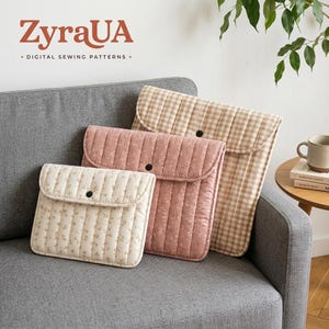 May include: Three quilted fabric pouches with flap closures and black snap buttons. The smallest is cream with tiny floral prints, the medium is dusty rose with floral prints, and the largest is beige and white gingham. Text reads ZyraUA.