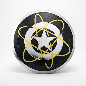 May include: A round shield with a black center, silver rim, and white and yellow design. The design includes a white star in the center, surrounded by a white circle and yellow curved lines. The shield has a metallic appearance.