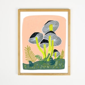 May include: A framed illustration of a cluster of gray and black mushrooms with yellow stems on a peach background. The mushrooms are surrounded by green foliage and white stars.