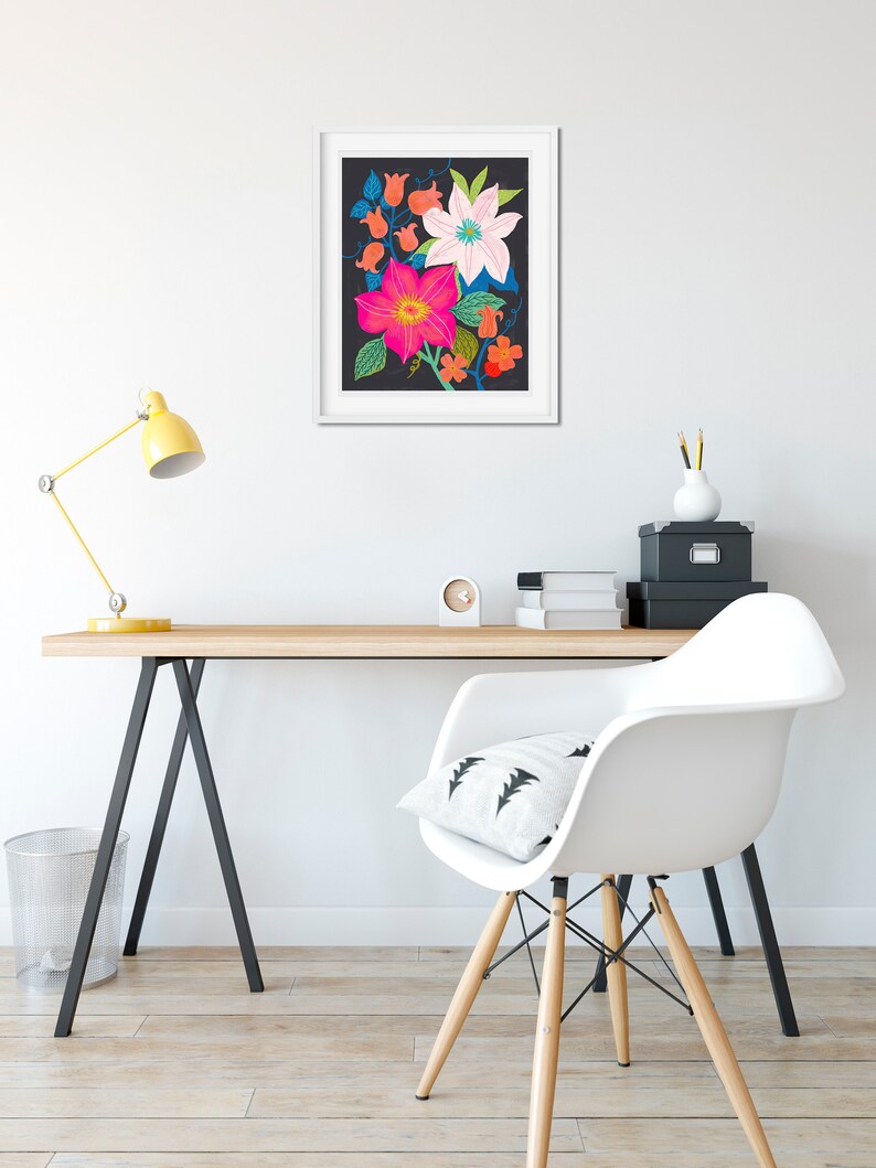 May include: A framed print of a colorful floral illustration on a black background. The flowers are pink, white, and blue with green leaves.